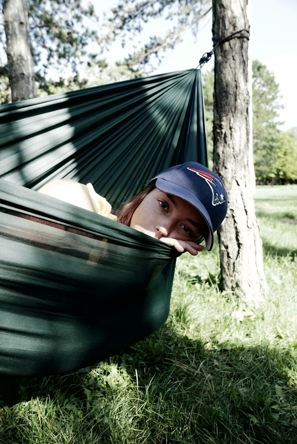 woman on green hammock