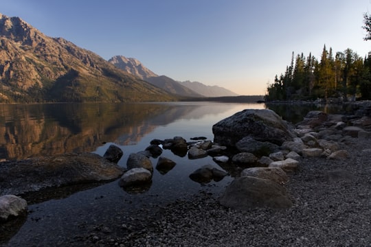 pile of stones beside body of water in Grand Teton National Park United States