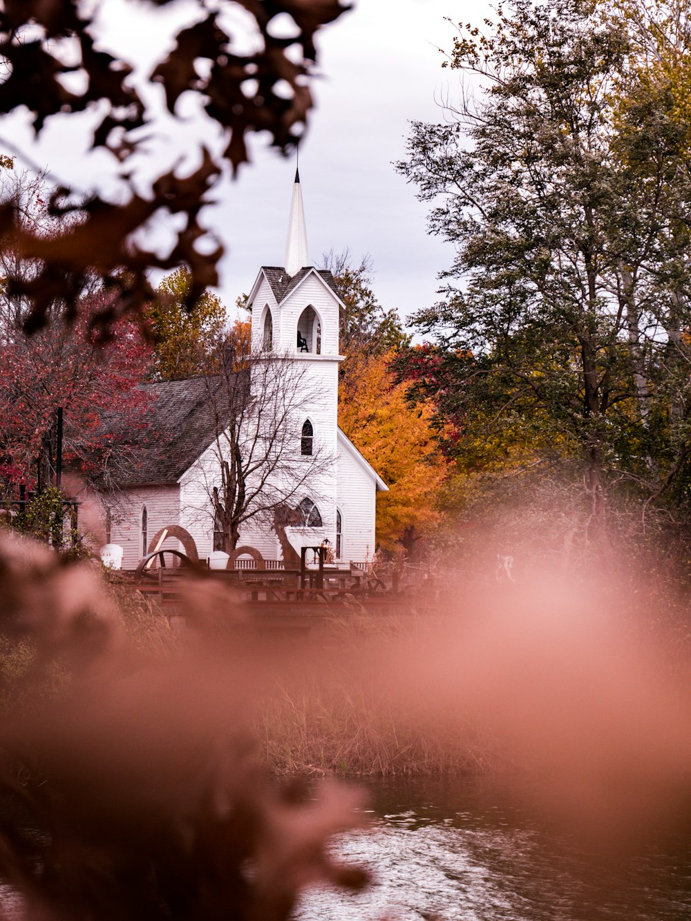 white church near body of water