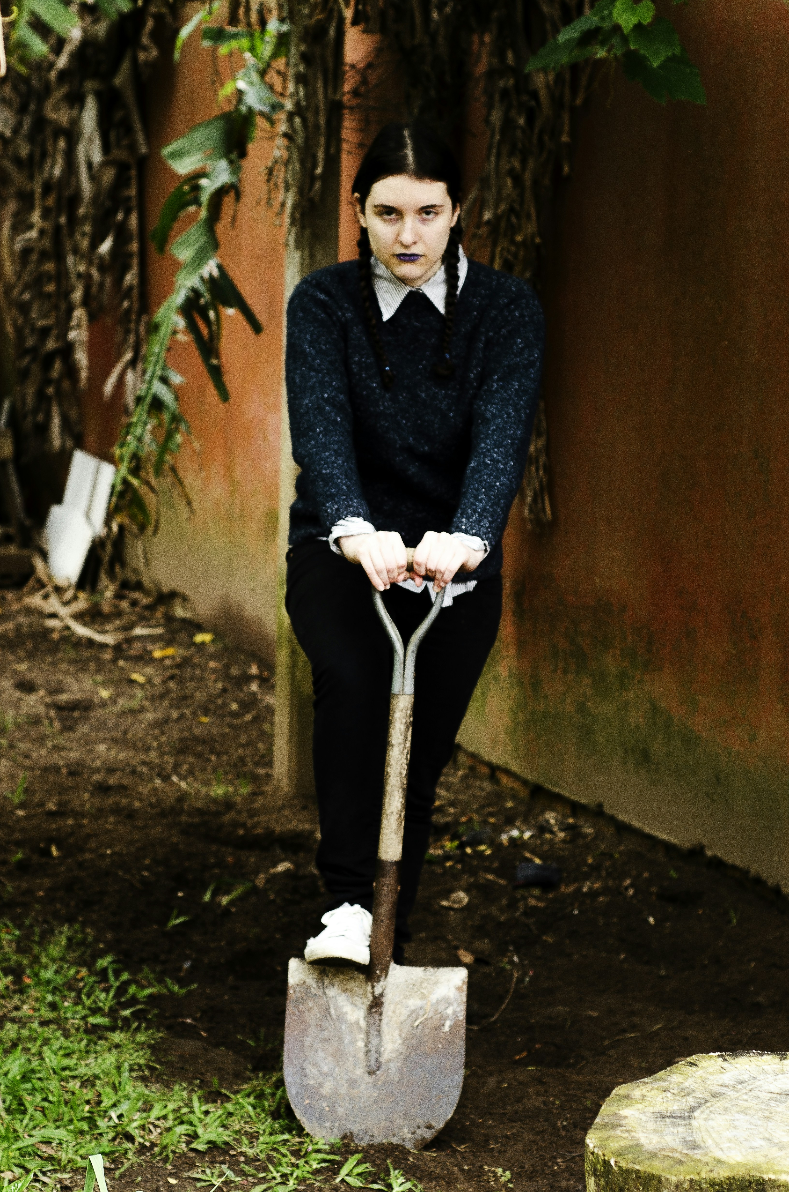 woman holding shovel near wall photo – Free Human Image on Unsplash
