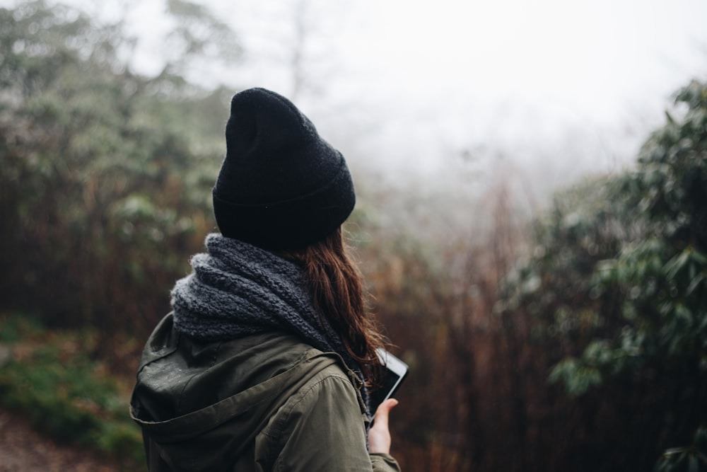 woman in black beanie hat and gray scarf