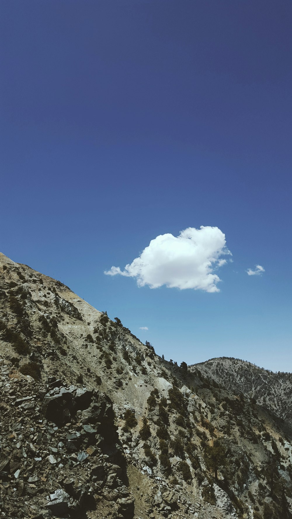 mountains under clouds