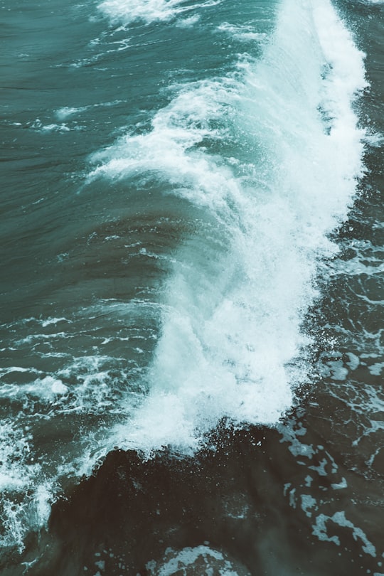 white and teal wave during daytime in Manhattan Beach Pier United States