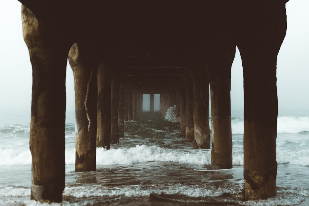 water waves hitting dock posts