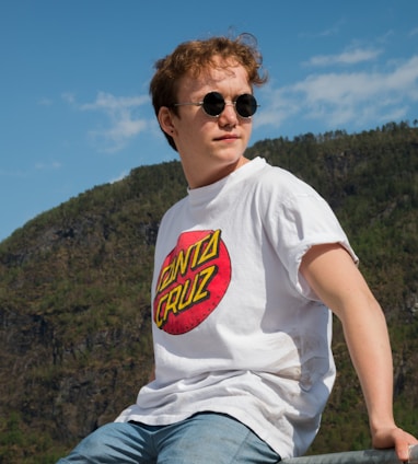 man wearing white and red Santa Cruz crew-neck shirt