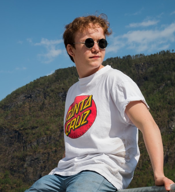 man wearing white and red Santa Cruz crew-neck shirt