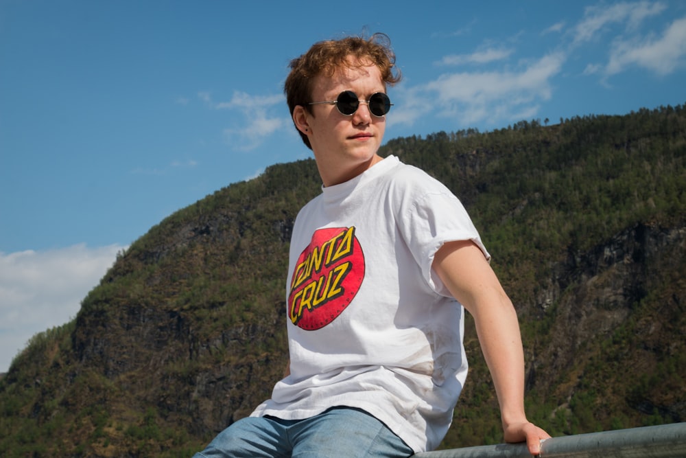 man wearing white and red Santa Cruz crew-neck shirt