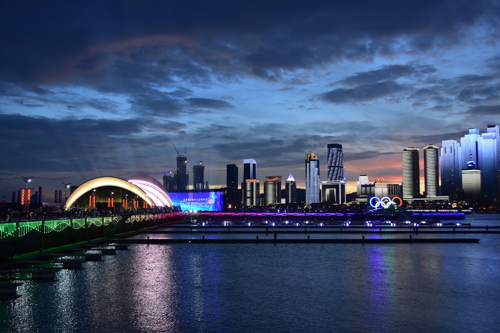 city buildings with lights turned on at night