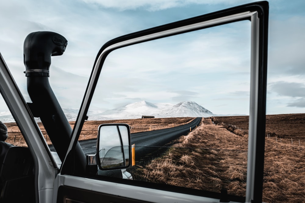 opened car door parked on roadside