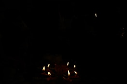 An elegant setting featuring various candle styles.