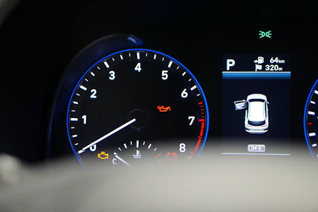 A vehicle dashboard showing warning lights related to body control module faults.