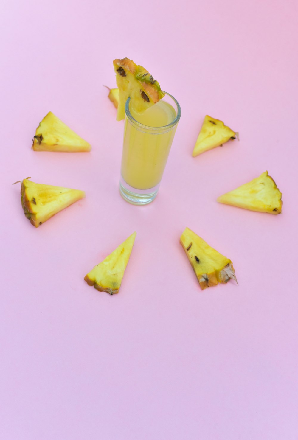 clear glass cup filled with pineapple juice