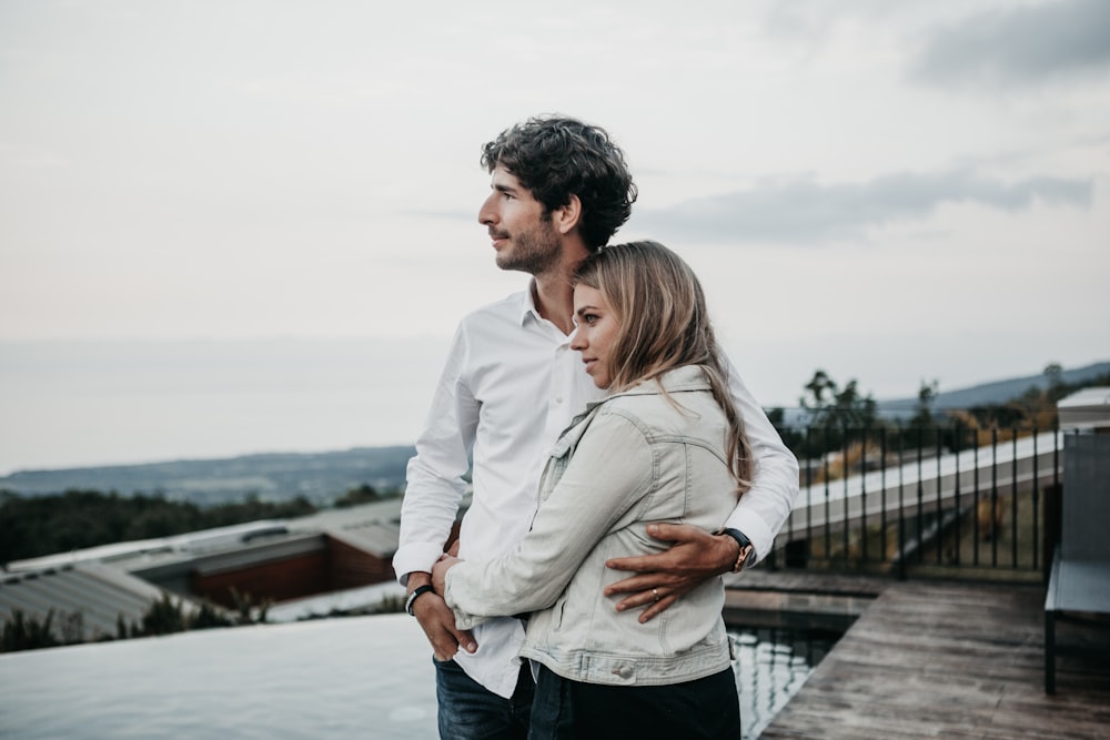 man and woman hugging each other