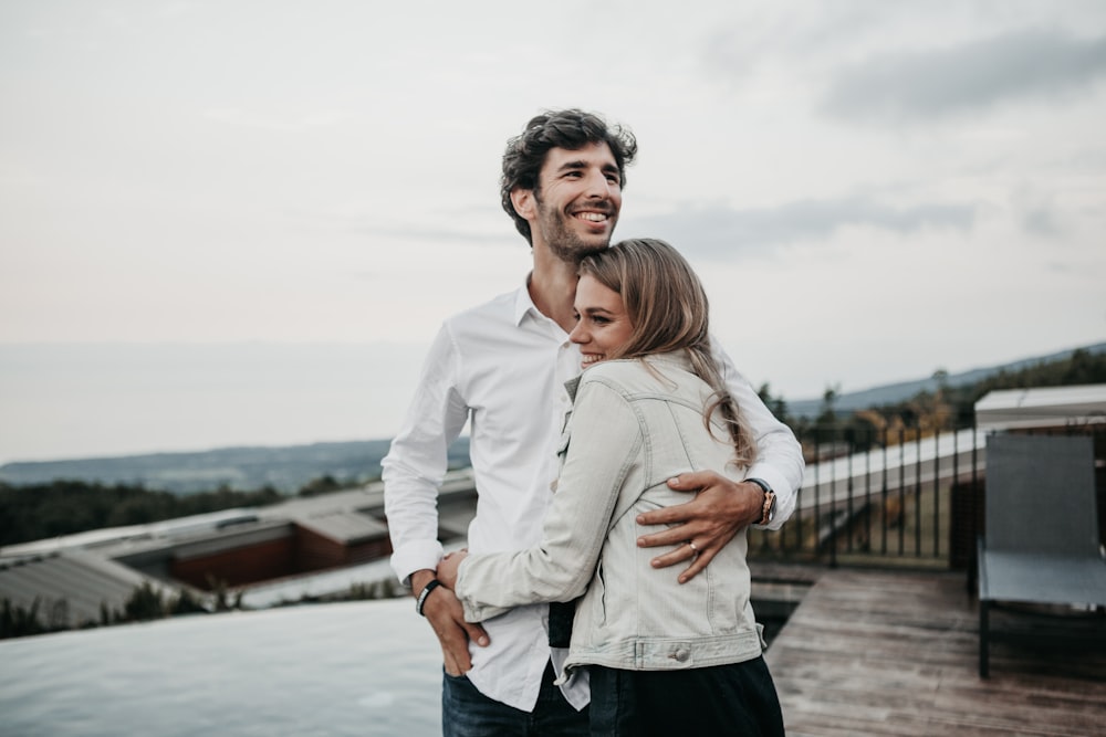 man and woman hugging each other