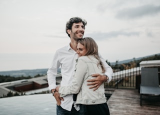 man and woman hugging each other