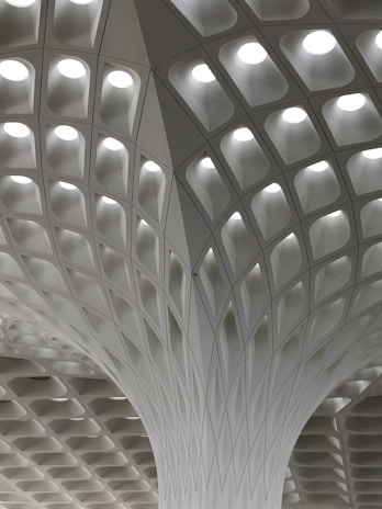 Decorative gypsum ceiling design featuring layered patterns and spotlights