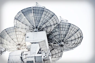 A close-up of a satellite antenna made from composite materials, showcasing its intricate design and lightweight structure.