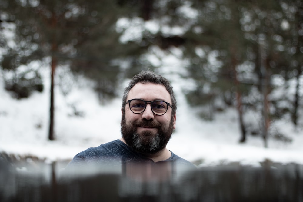 focus photography of man in blue top