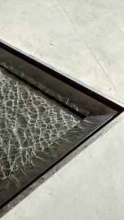 a metal tray with water running down it