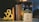 A collection of books is arranged vertically on a table, flanked by decorative bookends shaped like an ampersand. Next to the books, there is a white block with the inspirational quote 'WRITE WITHOUT FEAR. EDIT WITHOUT MERCY.' A pair of black glasses rests on the table in front.