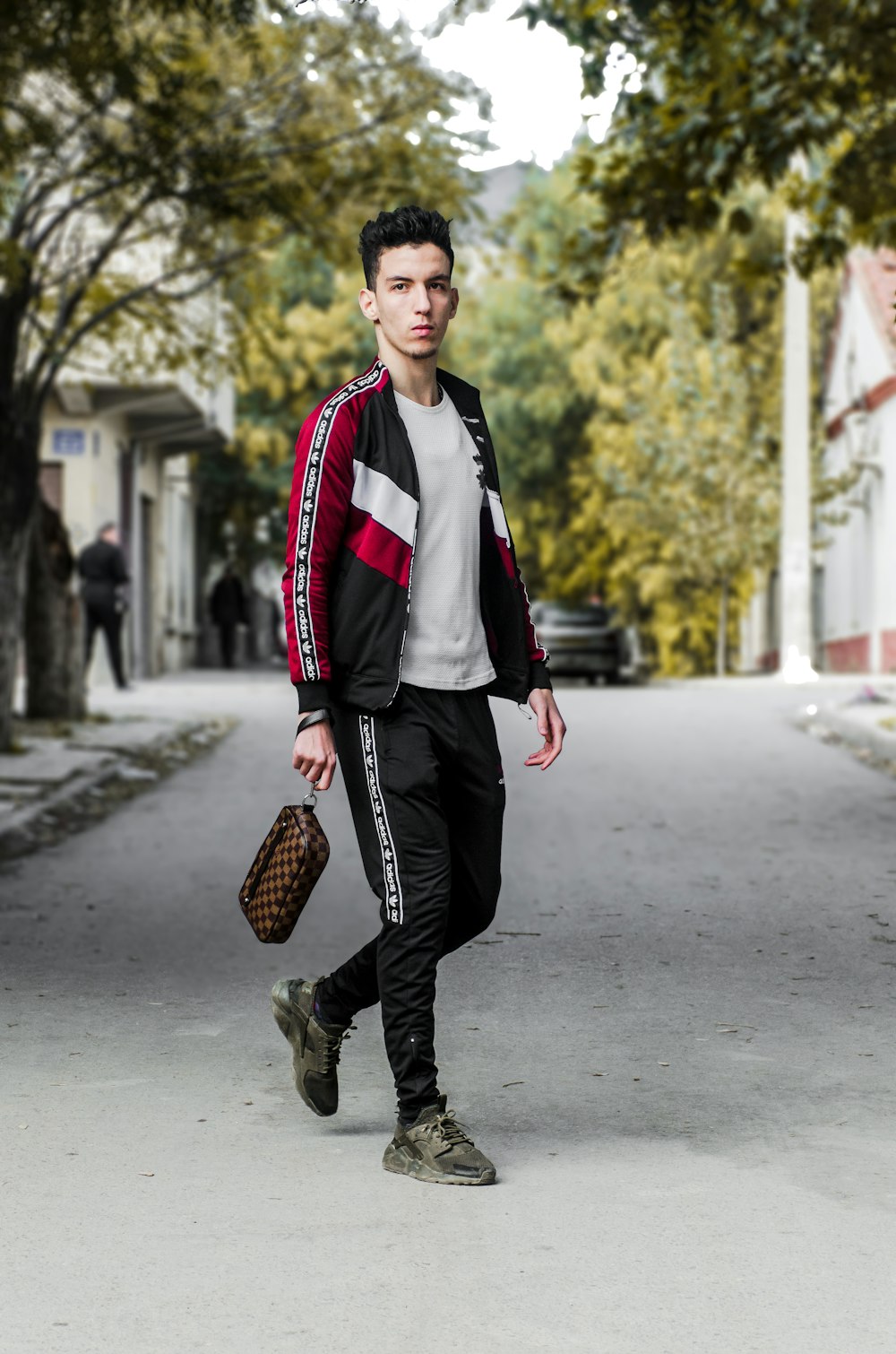 man wearing black and red jacket and black pants outfit