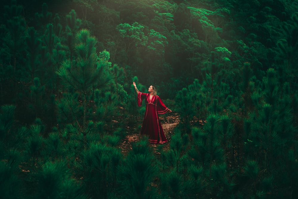 woman standing on forest