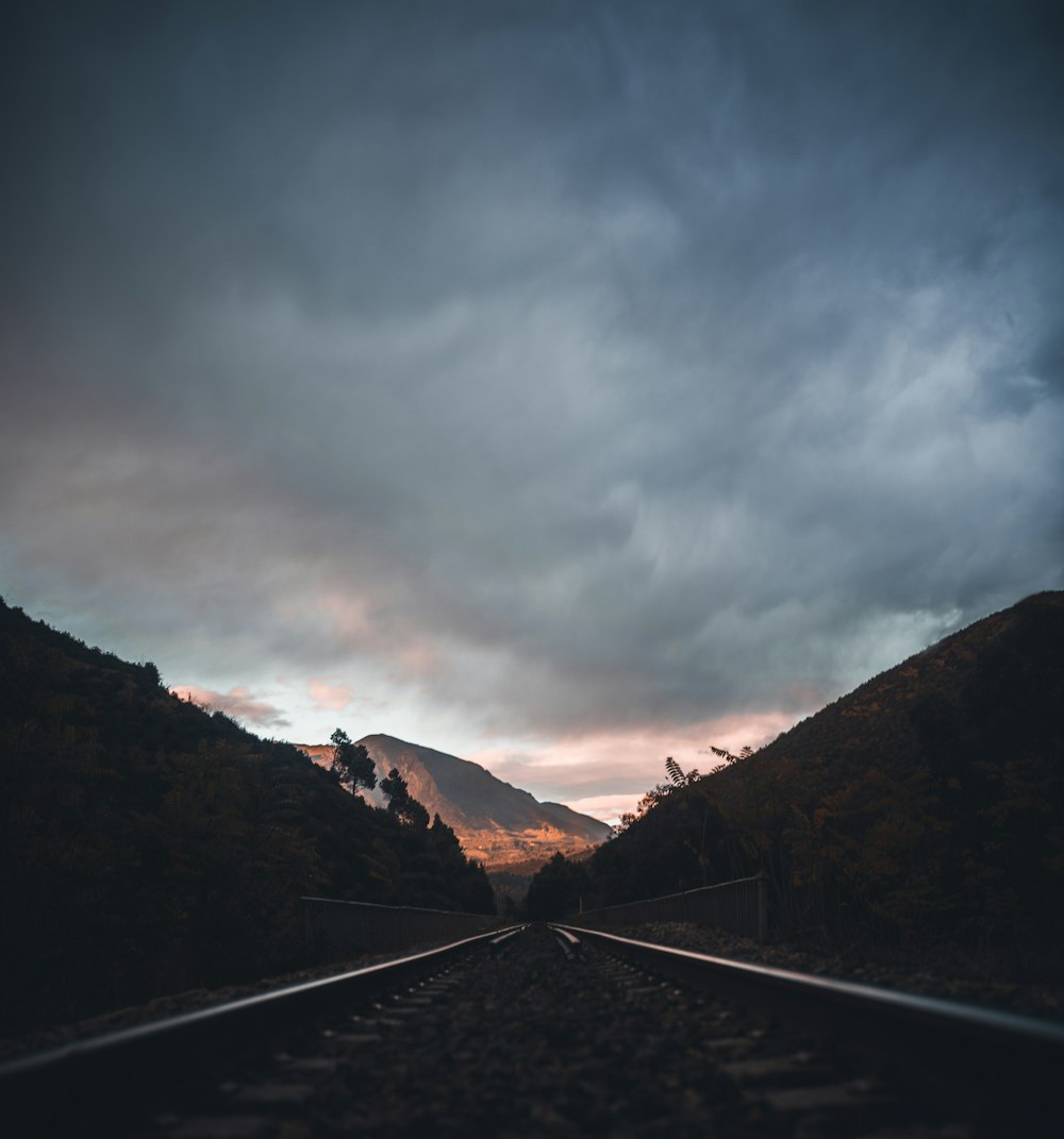 silhouette photography of train track