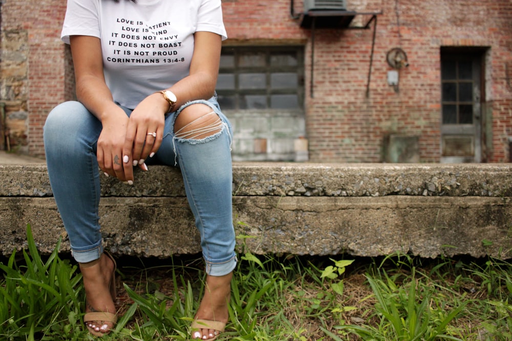 woman standing on concrete bench