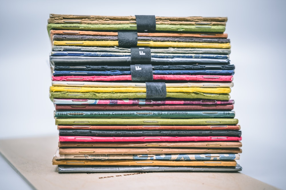 assorted-colored stacked books