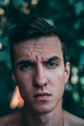 Close-up portrait of a popular Turkish TV series actor on set.
