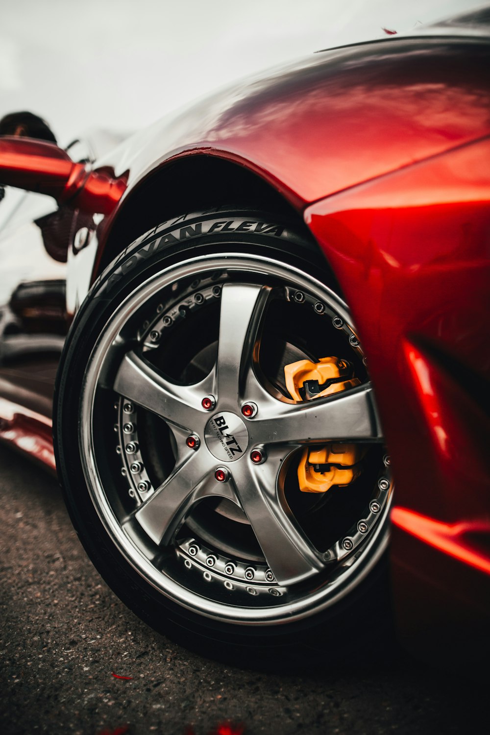 close-up photography of red sports car