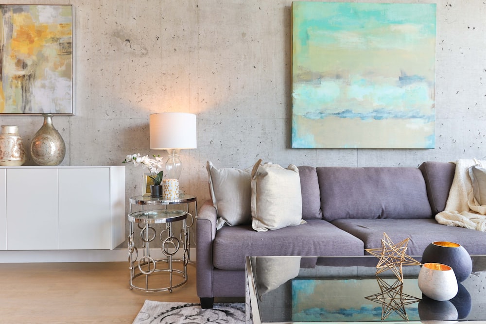 white wooden sideboard beside gray padded sofa