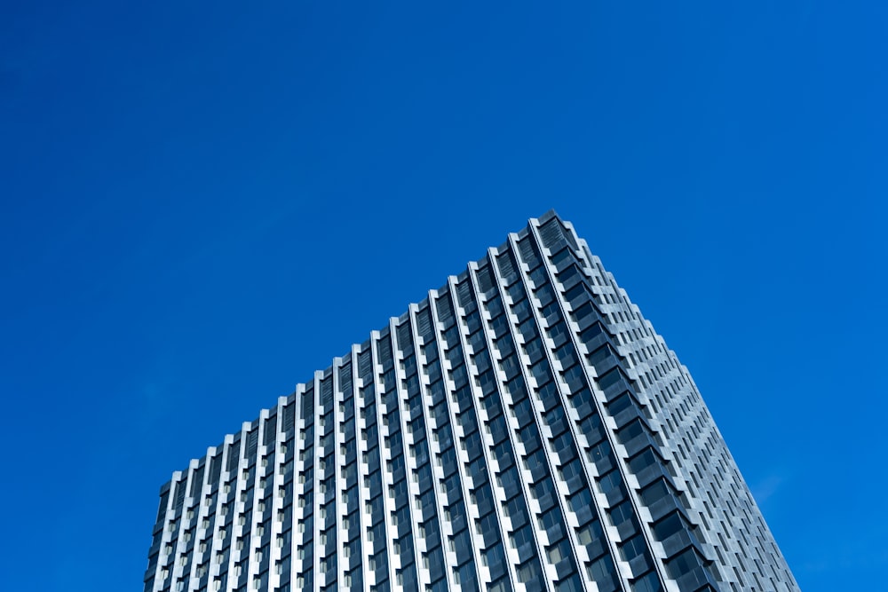 low angle photography of high-rise building under blue sky during daytime
