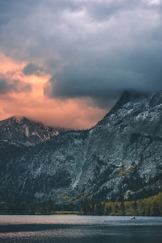 white clouds covering grey mountains in June Lake United States