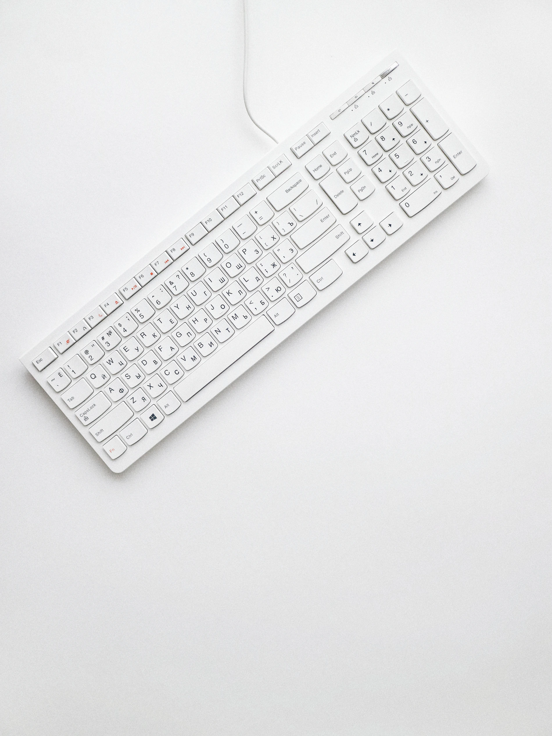 Gaming keyboard and mouse in a dark gaming desk setup