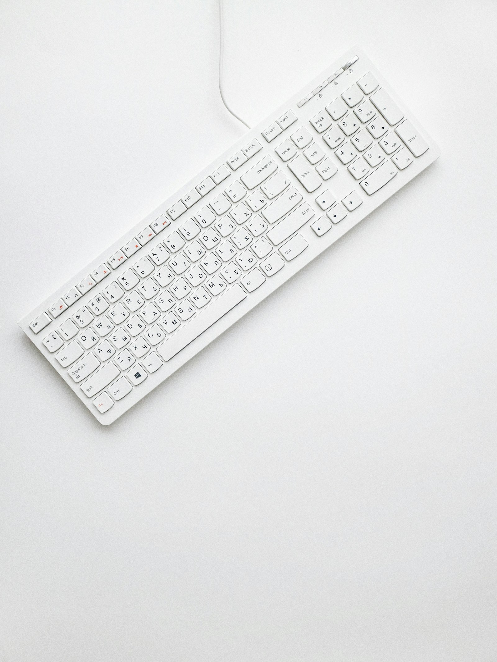 Canon EF-M 22mm F2 STM sample photo. White corded computer keyboard photography