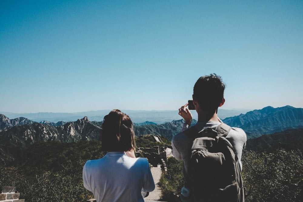 two persons looking at horizon