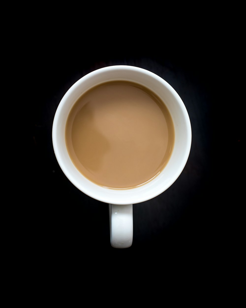 brown liquid in white ceramic mug