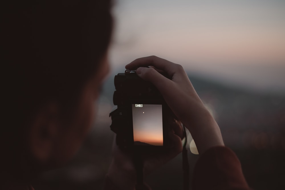 person taking photo of the stars