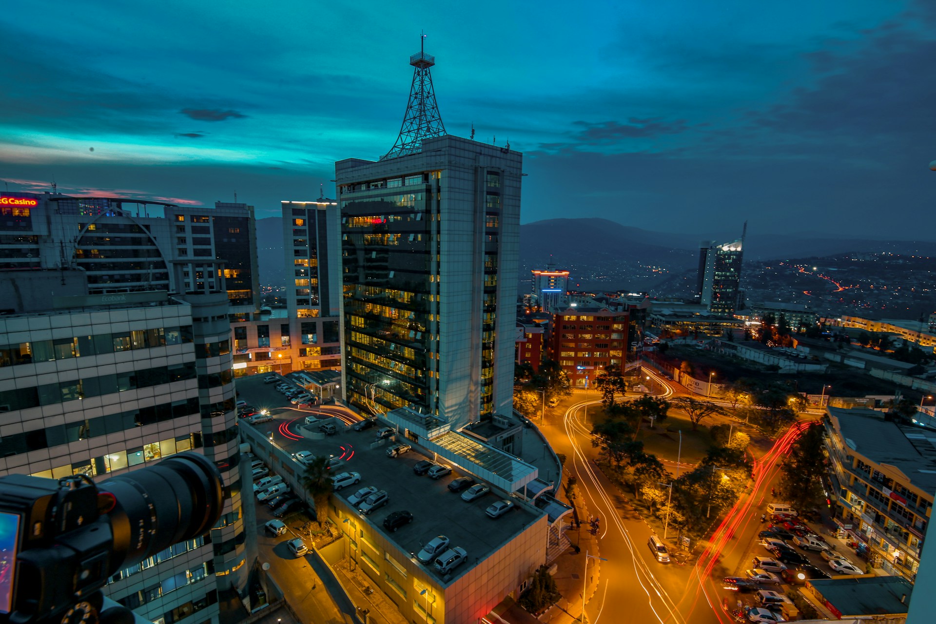 A dynamic snapshot from a recent documentary showing a bustling cityscape at dusk with glowing lights and busy streets.
