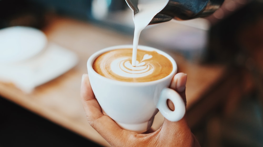 person making latte art