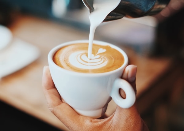 person making latte art