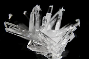 Elegant quartz crystals standing tall against a dark background