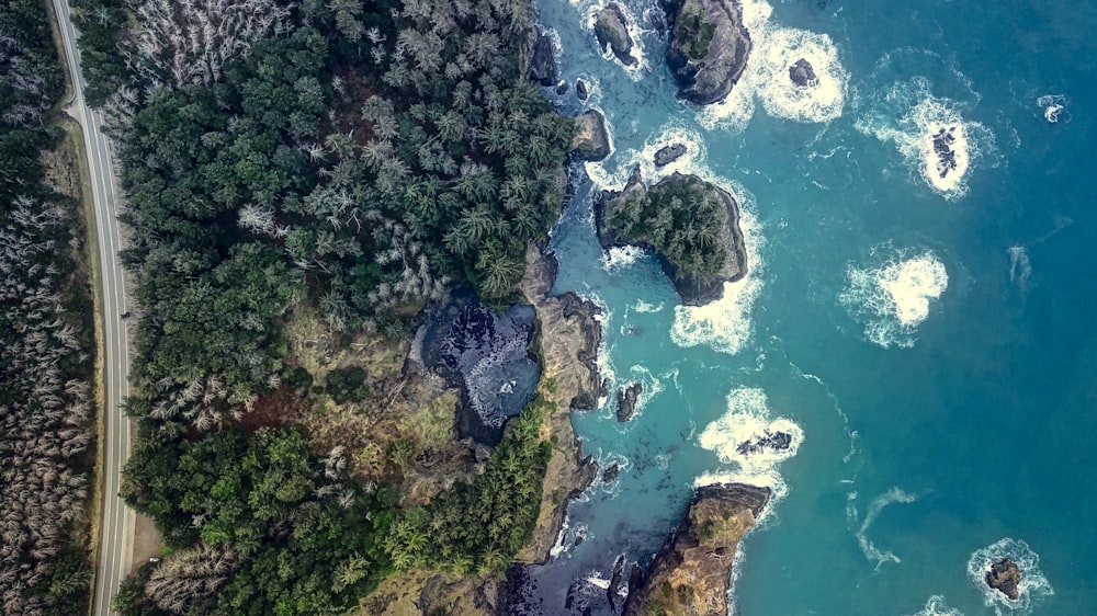 birds eye photography of body of water near mountain