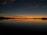 A serene image of a tranquil lake at sunset.