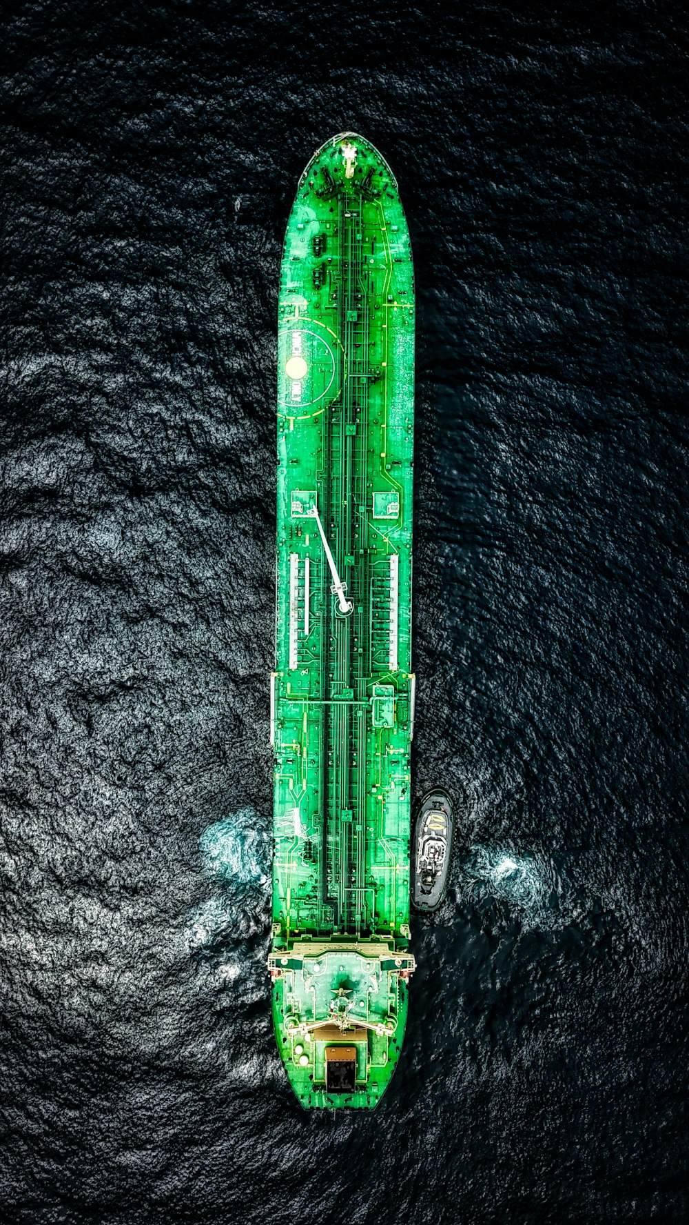 green cruise ship on ocean