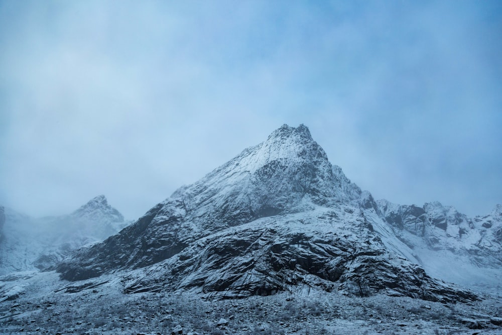 ice-capped mountains under white clouds