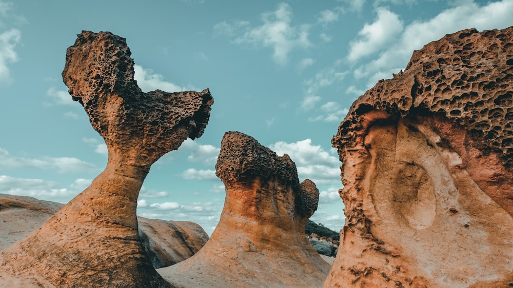 three brown rock formations