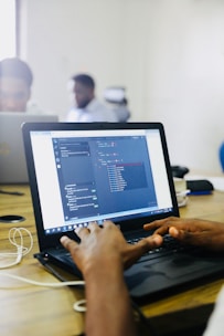 person using black laptop computer