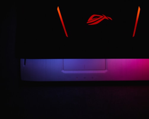 Abstract neon gradients blending into the silhouette of a cutting-edge Intel processor.